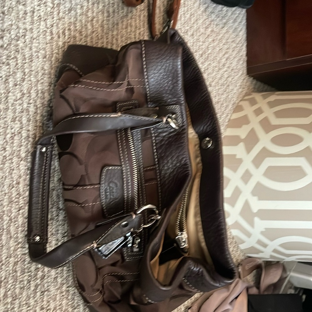 Coach purse dark brow 4 pockets including one middle seperatornpocket